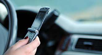 Massachusetts woman driving not knowing that Hand-Held Mobile Devices cause distracted driving