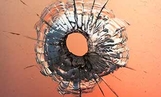 bullet hole through car window