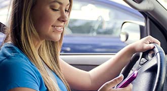 Teen girl texting and driving