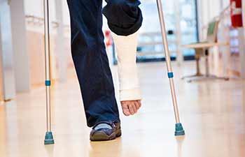 injured Newport car accident victim on crutches