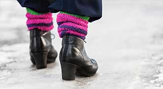 Cranston woman walking on icy side walk