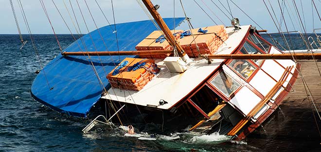 Boat sinking after an Boating Accident and the owner suffering from a boating injury