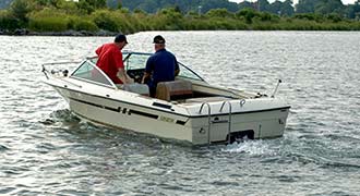 men in a boat on the water