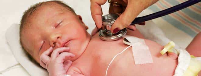 nurse listening to baby's heart