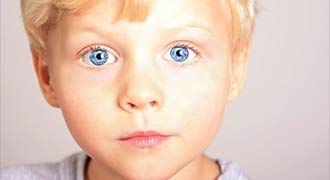 A child with blue eyes before getting lead poisoning in rhode island.