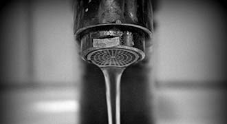 A sink faucet with running water is source for lead poisoning