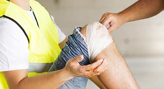 An employee with a hurt knee after a slip and fall injury.