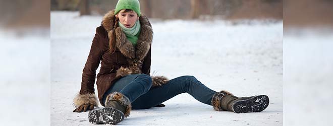 woman slips on frozen ice