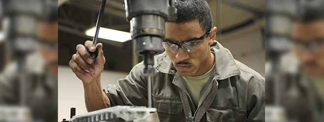 worker at drill press