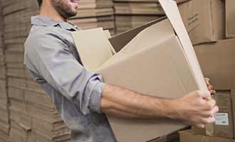 Rhode Island worker holding a heavy package