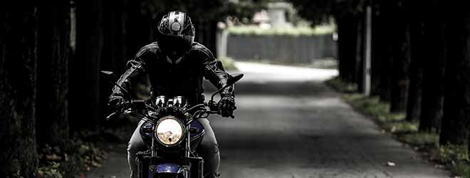 motorcycle rider wearing a motorcycle helmet to protect from a motorcycle accident brain injury