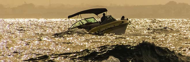 man driving boat during boating season in Rhode Island