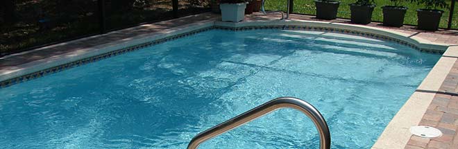 backyard pool with pool fence