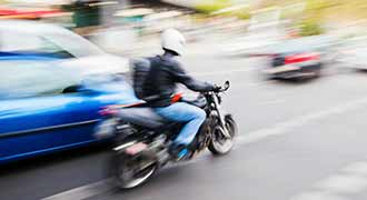 motorcyclist riding in traffic