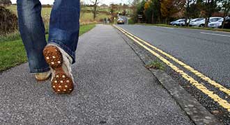 pedestrian walking along a street