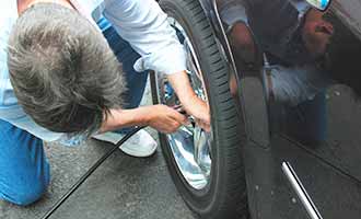 checking tire pressure before labor day weekend
