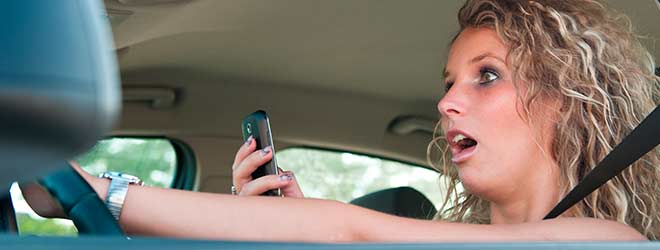 woman on phone while on driving