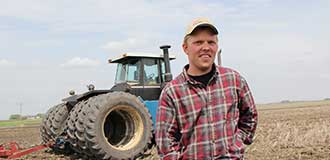 farmer infront of his tractor