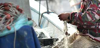 fisherman working on a net