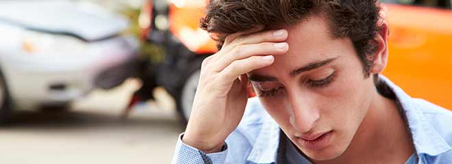 A stressed man waiting for his new bedford car accident lawyer to arrive.