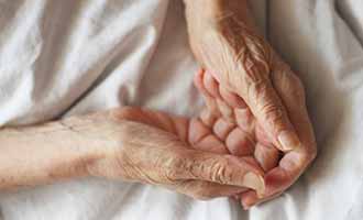 hands of an emotional abused elderly person