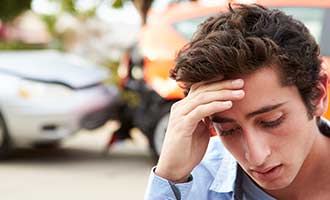 young man in shock after a car accident
