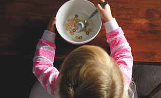 Child eating Breakfast Foods that has dangerous levels of Roundup Weed Killer