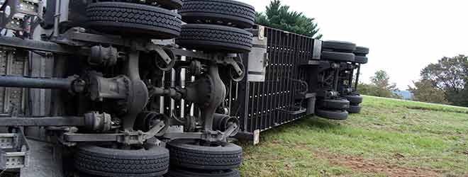 A truck laying on its side after a massachusetts trucking accident.