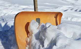 snow shovel to clean sidewalks that may cause Slip-and-Fall Accidents