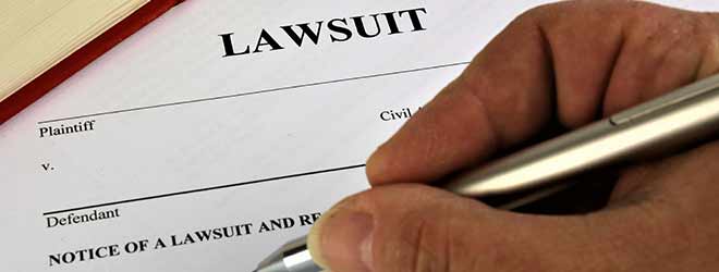 signing lawsuit form for Personal Injury Lawyer