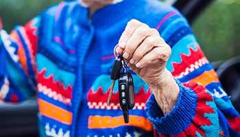 Elderly Driver handing over car keys