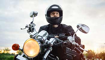 Motorcycle Rider wearing his helmet