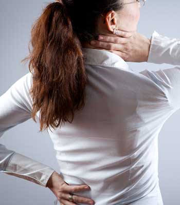 Woman with soreness in the neck or back area