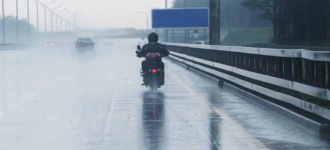 A motorcycle ride in the rain.