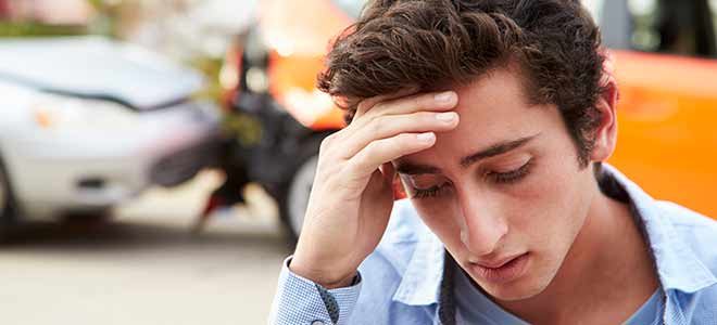 Young driver after a car accident