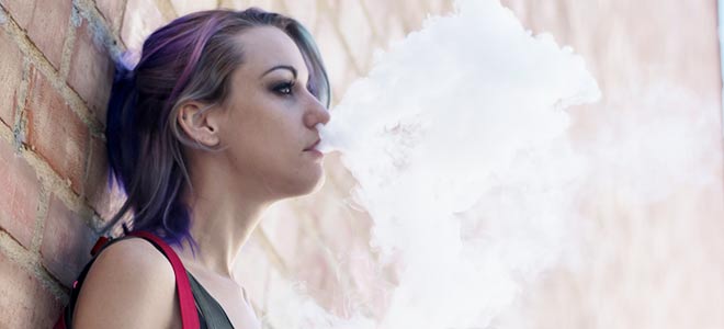 Woman having an e-cigarette