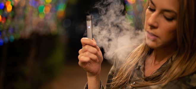 Woman with Failing E-Cigarette Batteries