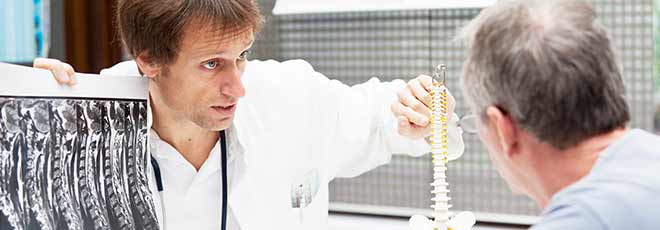 Doctor explaining spine injury to patient