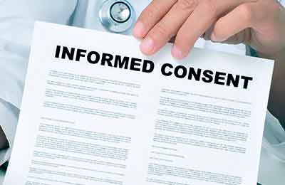 A doctor holding a piece of paper that reads "Informed Consent.
