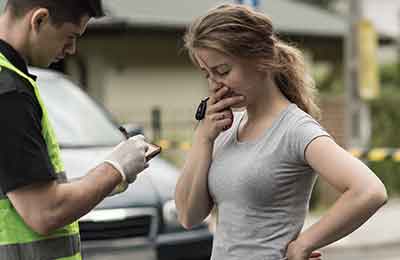 Woman talking to the police after a car accident