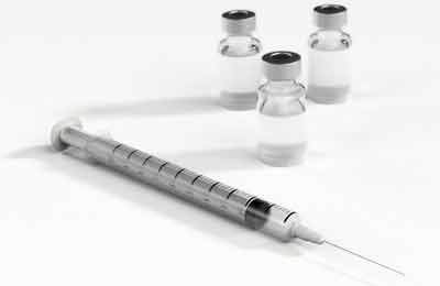 A needle with three injection bottles.