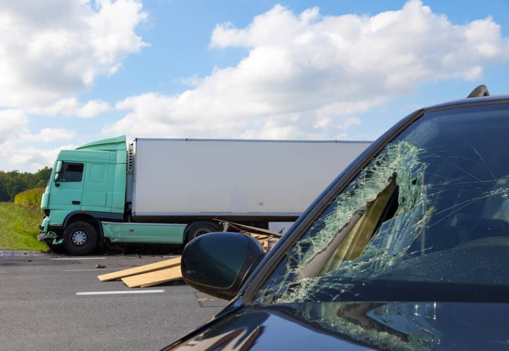 Car Damage After being hit by a Truck in an Accident
