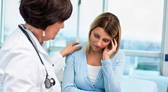 A doctor talking to a patient. 