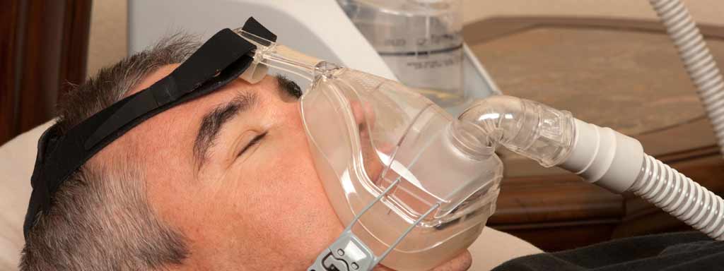 A man wearing a CPAP device.