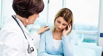doctor consulting woman with cancer