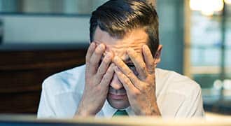 A man frustrated talking to his legal malpractice lawyer.