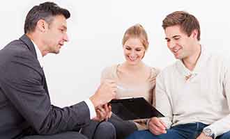 Lawyer with clients talking about their personal injury case