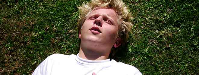 Man on ground having a seizure disorder