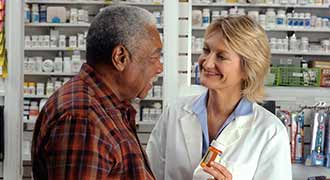 A pharmacist talking to a patient. 