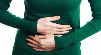A woman experiencing severe abdominal pain.